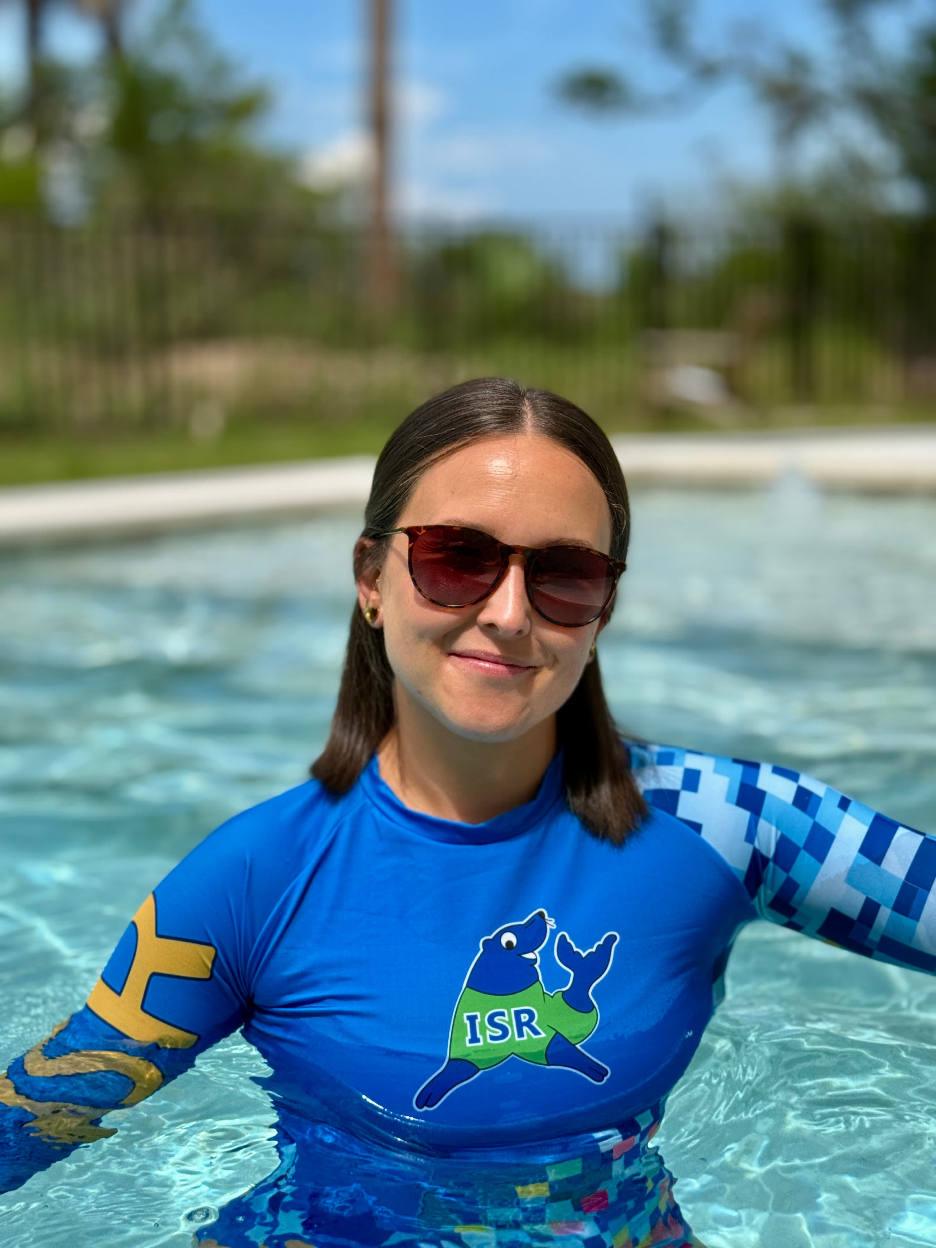 Shelby Canclini wearing sunglasses and smiling
